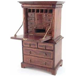 A miniature walnut and feather banded secretaire, the fall front above two short and two long dra...