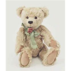 An 'Affable bear', blonde mohair teddy bear, with glass eyes, velvet pads and growler, 20.5ins...