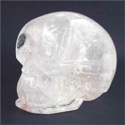 A white quartz crystal skull with carved and part polished features 6.5ins high...