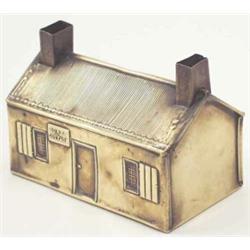 A Victorian brass money box, modelled as Robert Burns' cottage, 4.75 ins....