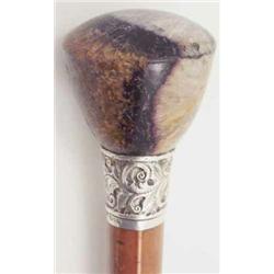 An Edwardian Blue-John handled walking stick, the large domed handle on malacca cane with foliate...