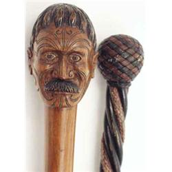 A Maori walking stick and a knot stick, the former carved with the head of a Maori warrior, the o...