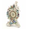 Image 1 : A German floral encrusted porcelain mantel timepiece, with cherub surmount, 9.25ins...