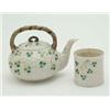 Image 1 : A First period Belleek teapot, moulded with shamrocks against a woven-effect ground, 6ins and a n...