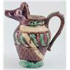Image 1 : A 19th century French faience jug, with boar's head pouring lip, relief moulded with leaves and s...