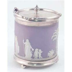 A Wedgwood lilac jasperware biscuit barrel, with silver plated cover and swing handle, 9.5ins...