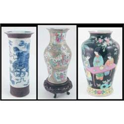 A 19th century Canton baluster vase, painted with figures in interior settings in Famille Rose en...