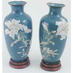 A pair of 19th century cloisonne vases, of oviform floral decorated against mid-blue ground on wo...