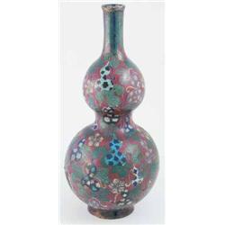 An early 19th century Japanese cloisonne double-gourd vase, enamelled with guards and foliage aga...