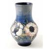 Image 1 : A Moorcroft Anemone vase, of bulbous shape with continuous design against a blue ground, Potter t...
