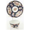 Image 1 : A Worcester tea bowl and saucer, painted with asymmetric panels of flowers in Kakiemon palette, r...