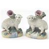 Image 1 : A pair of Victorian sheep and ram spill vases standing on oval cushion bases, 3.5in....