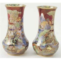 A pair of Carltonware vases painted with a Mikado-type pattern of pagodas, a garden scene and mou...