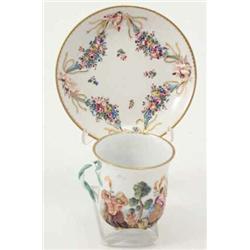 A late 19th century Doccia cup and saucer relief-moulded and enamelled with an allegorical chario...
