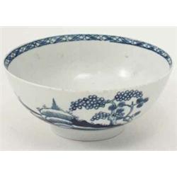 An 18th century Liverpool bowl, painted with the "Blue Rock" pattern in underglaze blue, exhibiti...