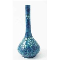 An art pottery vase made for Liberty's, 'Hadcote' series, moulded with pale flowers in raised sli...