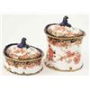 Image 1 : Two Royal Crown Derby boxes and covers, each printed with foliage and gilded royal blue borders,...