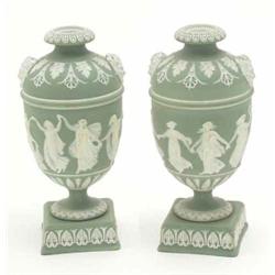 A pair of Wedgwood green jasperware vases, decorated with dancing nymphs in a neo-classical style...