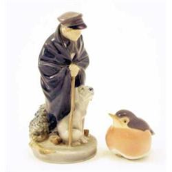 A Royal Copenhagen figure, of a herder with his dog, together with a model of a Robin, herder 7.2...