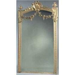 A 19th century French giltwood and gesso overmantel, with arched top surmounted by a cartouche pe...