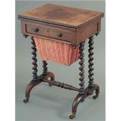 An early Victorian rosewood writing/work table, with leather lined folding top, frieze drawer and...