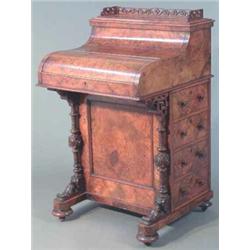 A late Victorian figured walnut piano top davenport, the pop up section with pierced gallery, pul...