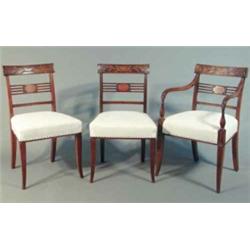 A set of 10 late George III mahogany dining chairs, (including two with arms) with leaf carved la...