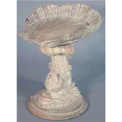 A 19th century Italian pine grotto stool, with scallop shell seat on dolphin base, height 1ft 10i...