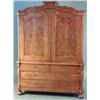 Image 1 : An early 19th century Dutch figured walnut armoire, with moulded scroll pediment and two fielded...
