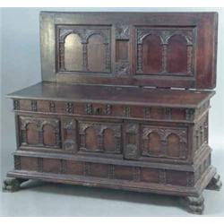 A late 17th century/early 18th century Spanish oak coffer, the rising lid carved on the underside...