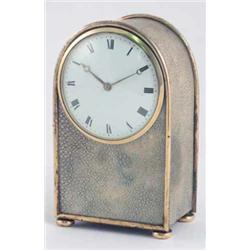 A 19th century "Jump style" shagreen mantel timepiece, with convex enamelled dial and moon hands,...