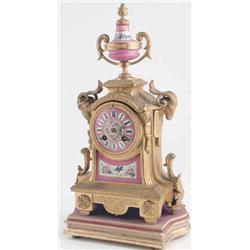 A late 19th century French ormolu mantel clock, with Sevres-type porcelain dial and Japy movement...