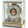 Image 1 : A Jaegar-Le Coultre Atmos mantel clock, enclosed within glass and brass case, movement visible wi...