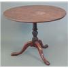Image 1 : A George III mahogany circular occasional table, on turned and spiral fluted stem and tripod base...