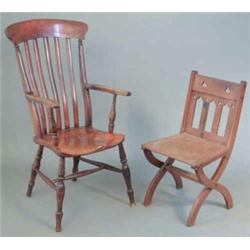 A Victorian Windsor chair, with elm seat on turned legs and a Victorian Gothic style cross frame...