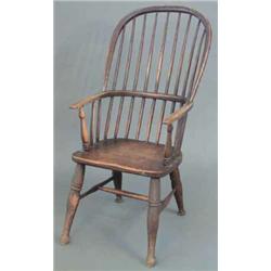 An early 19th century rustic comb back ash chair, on turned legs...