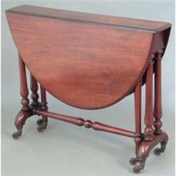 A Victorian mahogany oval top Sutherland table, on end standards, fitted china castors, 3ft...