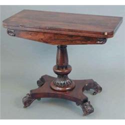 A William IV rosewood card table, on lappet stem and platform with four acanthus leaf carved scro...