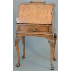 A figured walnut bureau de dame, with slant and drawer on cabriole legs with hairy claw feet, 2ft...