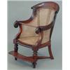 Image 1 : A George IV mahogany childs bergere high chair, with caned back and seat (lacks base, replaced fo...