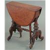 Image 1 : A small Victorian figured walnut oval top Sutherland table, on turned and carved end standards, 1...