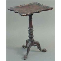 An early Victorian oak occasional table, with carved picture frame style top on fluted and lotus...
