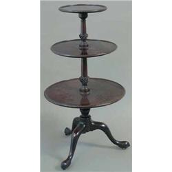 A George III mahogany 3-tier circular dumb waiter, with tapered and spiral fluted columns and tri...