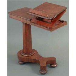 A Victorian mahogany bed table, with ratchetted book rack and telescopic stem, 2ft 5ins...