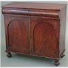 Image 1 : A William IV mahogany chiffonier, with convex frieze drawer and 2 doors below on reeded bun feet...