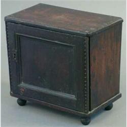 An 18th century oak spice cabinet, with single door enclosing 1 long and 12 small drawers, 1ft 4i...