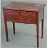 Image 1 : A George IV mahogany low boy, with one long and two short drawers, fitted brass loop handles on s...