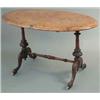 Image 1 : A Victorian inlaid figured walnut oval occasional table, on carved end standards, fitted china ca...