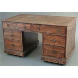 A Regency rosewood desk, of pedestal form with tan skiver and two long and four short drawers fit...