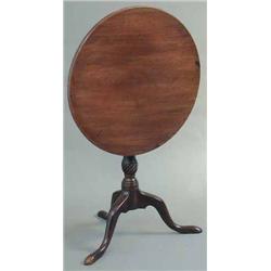 A George III mahogany circular occasional table, on tapered stem with spiral fluted knop and swep...